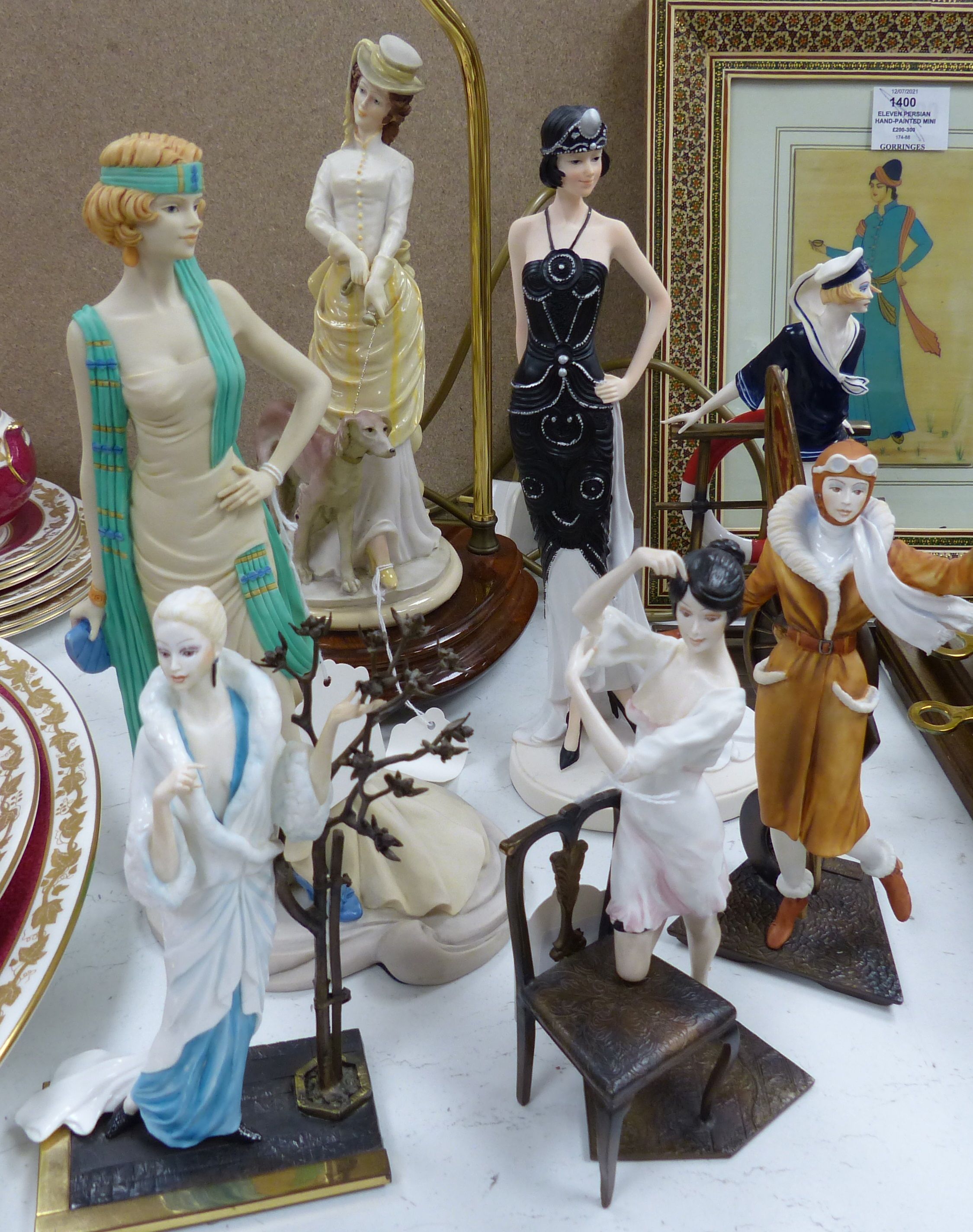 Four Albany bronzed metal and ceramic of elegant 1920's ladies, including 'Female Aviator', three other figures and a table lamp (8)